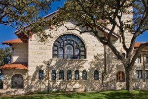 Richardsonian stone church façade newly restored by Heimsath Architects.
