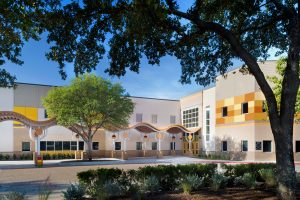 Festive elementary school is an adaptive reuse of abandoned industrial warehouse in Austin. Padron Elementary AISD.