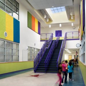 Classrooms get natural light through skylights in the central corridor. Adpative reuse school, Padron Elementary, Austin ISD.