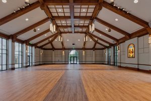 Multi-use parish hall serves church and school functions and is designed also for special worship services, by Heimsath Architects.