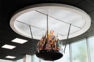 Eternal flame is crafted from pieces of destroyed stained glass windows. Stanton Studios commissioned by Heimsath Architects.