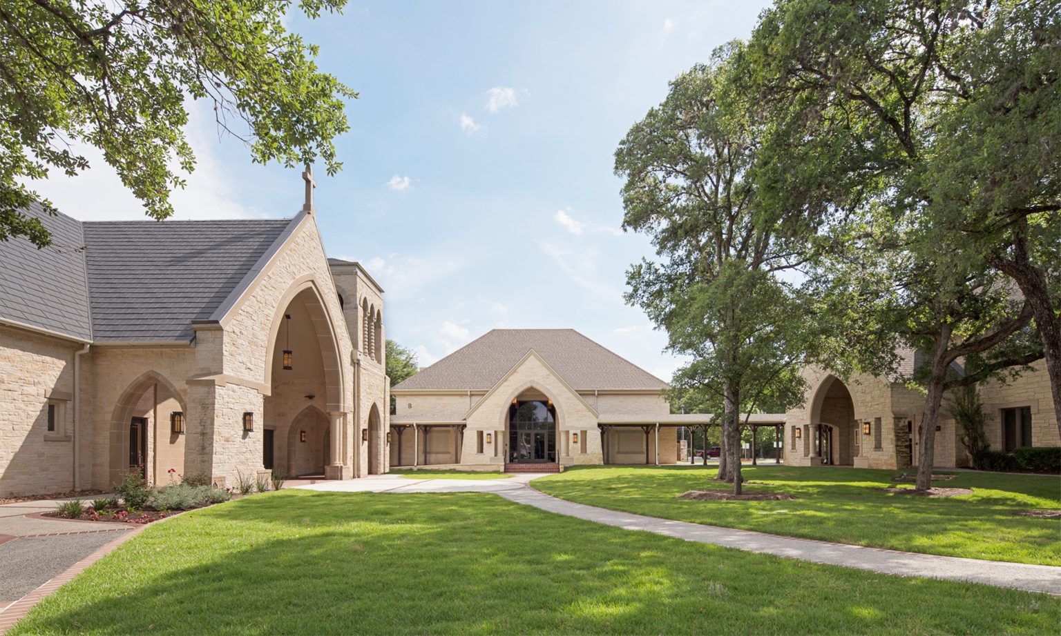 Multiple building phases originated from our original master plan. New narthex and bell tower completed the courtyard concept.