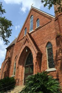 Restored historic brick church with gothic arched entry. St. John’s Episcopal, Tallahassee, Florida.